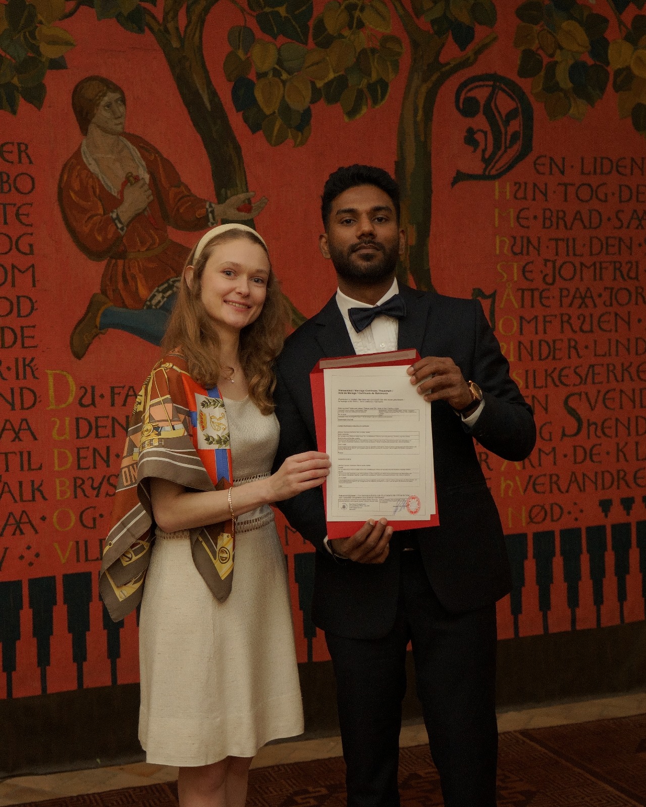 Holding the marriage certificate