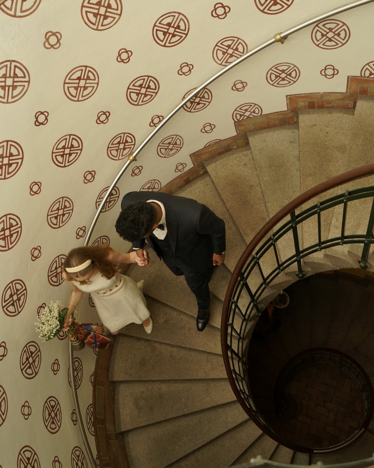 Sarath and Marjorie on spiral staircase in Copenhagen